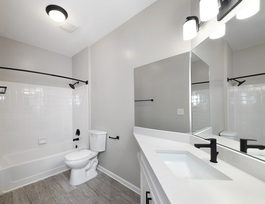 Bathrooms with quartz countertops and designer light fixtures (Legacy)
