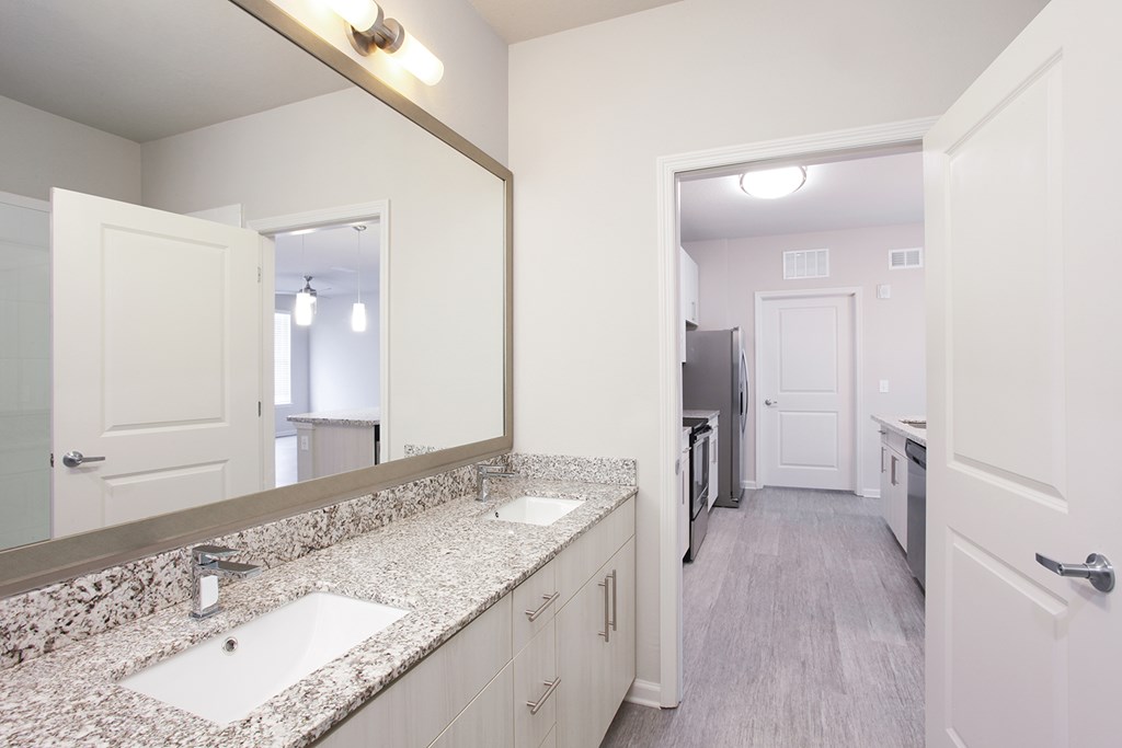 Phase II units include dual vanities, granite countertops and framed mirrors