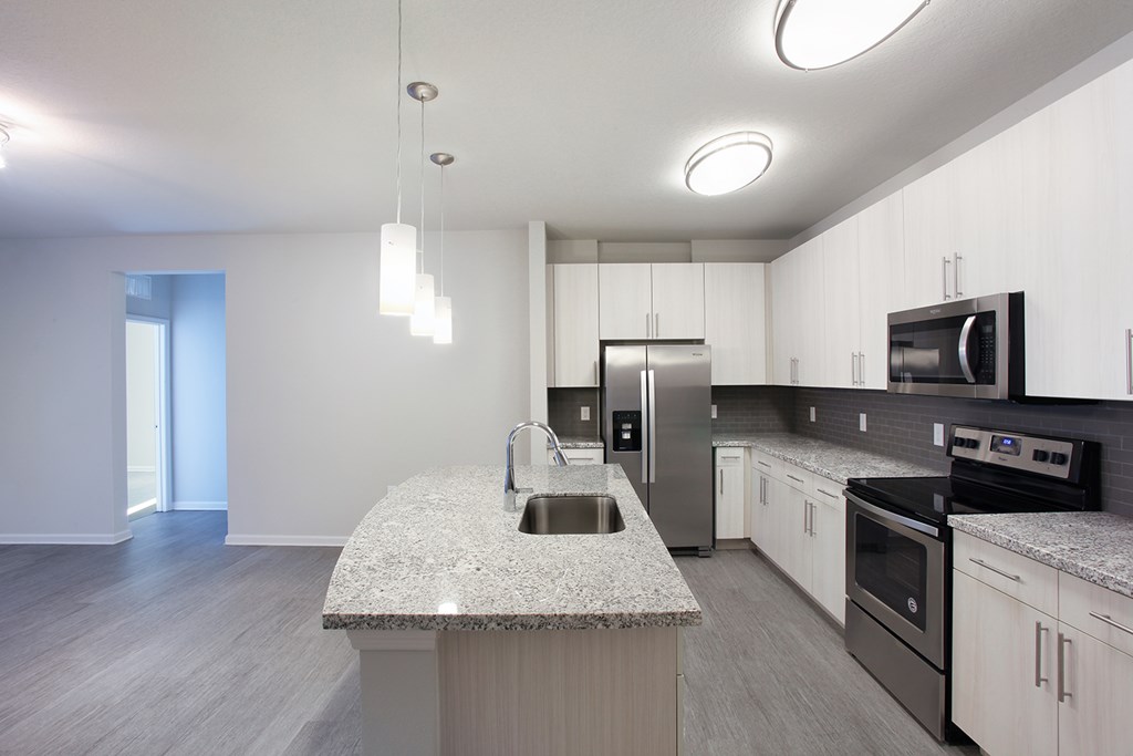 Kitchen islands overlooking spacious living room and dining room