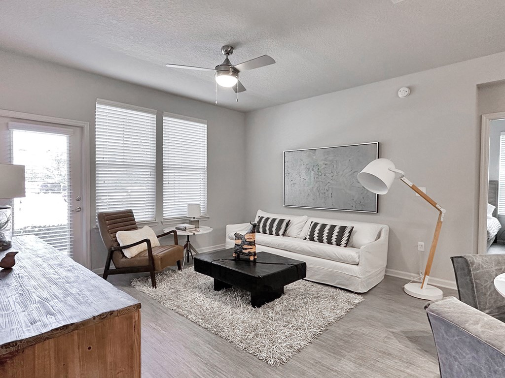 Open-concept living areas with hardwood-inspired flooring