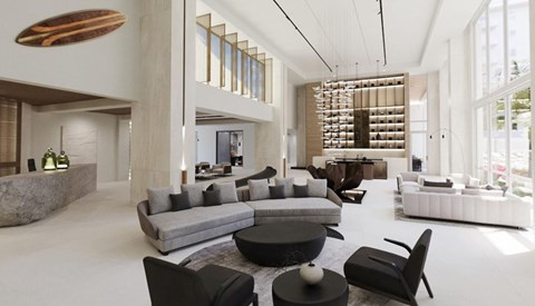A modern living room with a large grey sofa and a black coffee table.