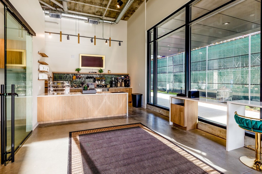 A reception area with a desk and a chair.