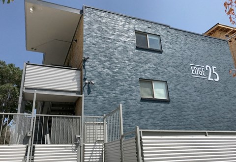 A modern building with the sign "EDGE 25" on the side.