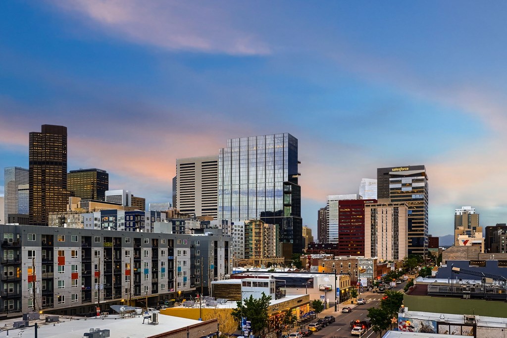 A cityscape with buildings and a clear sky.
