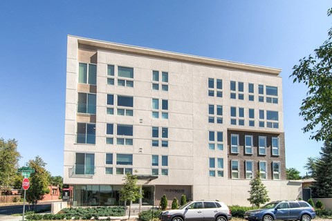 A modern building with a clear blue sky in the background.
