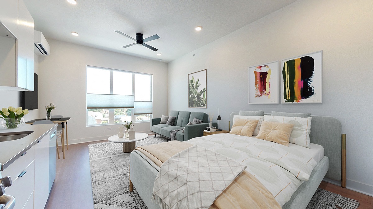 A bedroom with a large bed and a painting on the wall.