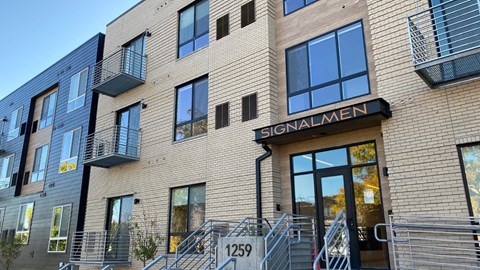 The building is called Signalmen and has a black awning.
