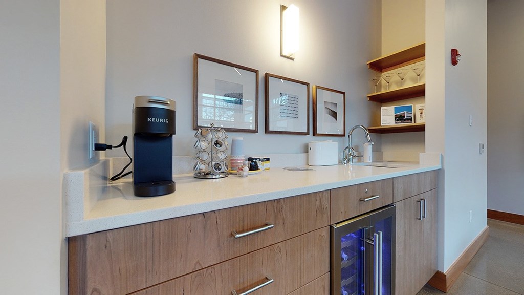 A kitchen with a coffee maker and a dishwasher.