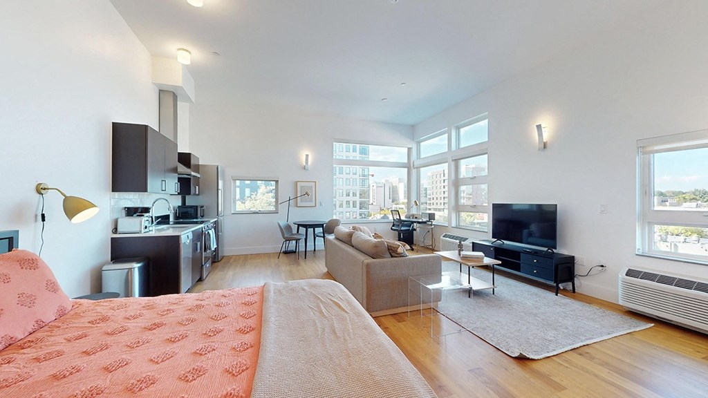 A living room with a couch and a television.