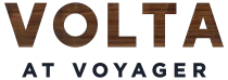 The image displays the word "VOLTA" in large letters with a wooden texture, followed by "AT VOYAGER" in smaller letters below it.