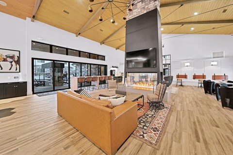 A living room with a couch and a fireplace.