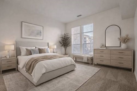 A bedroom with a large bed, a dresser, and a mirror.