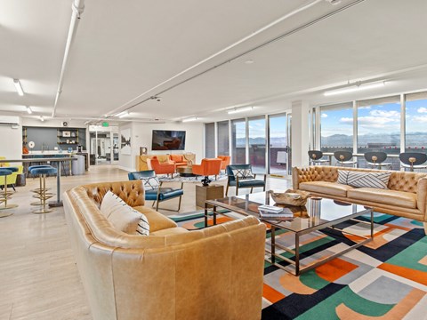 A living room with a large couch and a coffee table.
