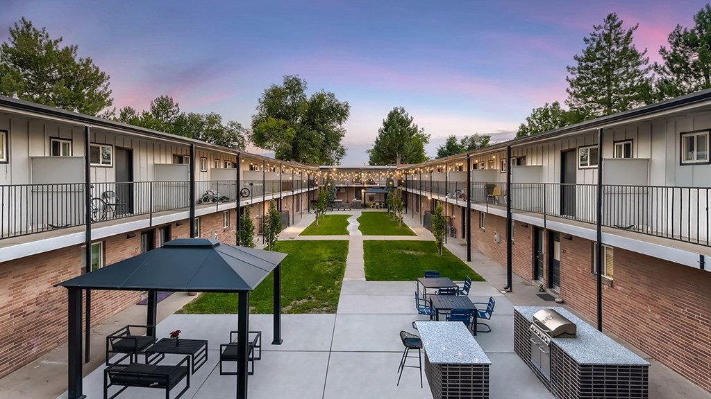 A sunny day at the outdoor seating area of a residential complex.