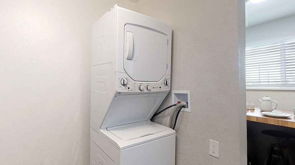 A white oven with a microwave above it is installed in a kitchen.