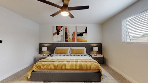A bedroom with a bed, two lamps, and a ceiling fan.