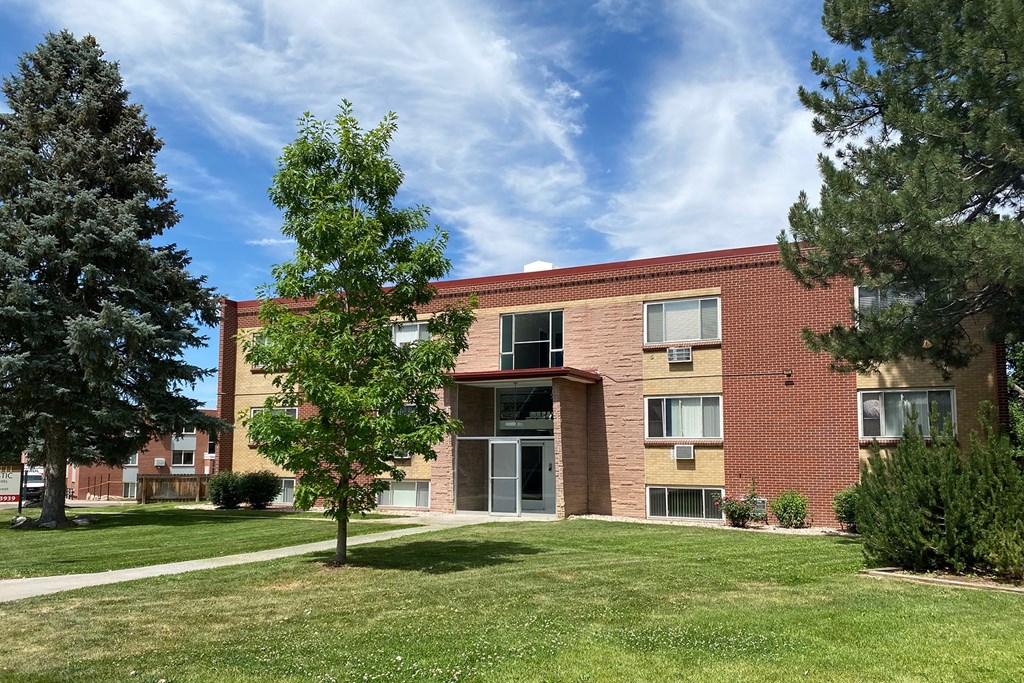 South Majestic Apartments showing a red brick building with a tree in front of it.