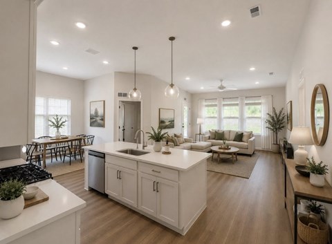 A modern kitchen with white cabinets and a central island.