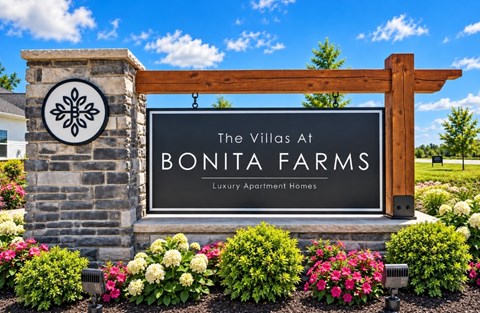 A sign for The Villas at Bonita Farms, a luxury apartment home community.