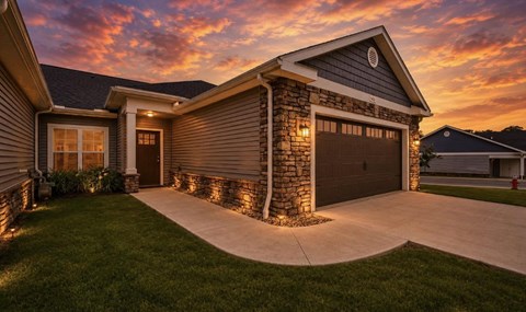 A house with a garage and a driveway.