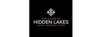 The image is a logo for The Villas at Hidden Lakes, a luxury apartment home.