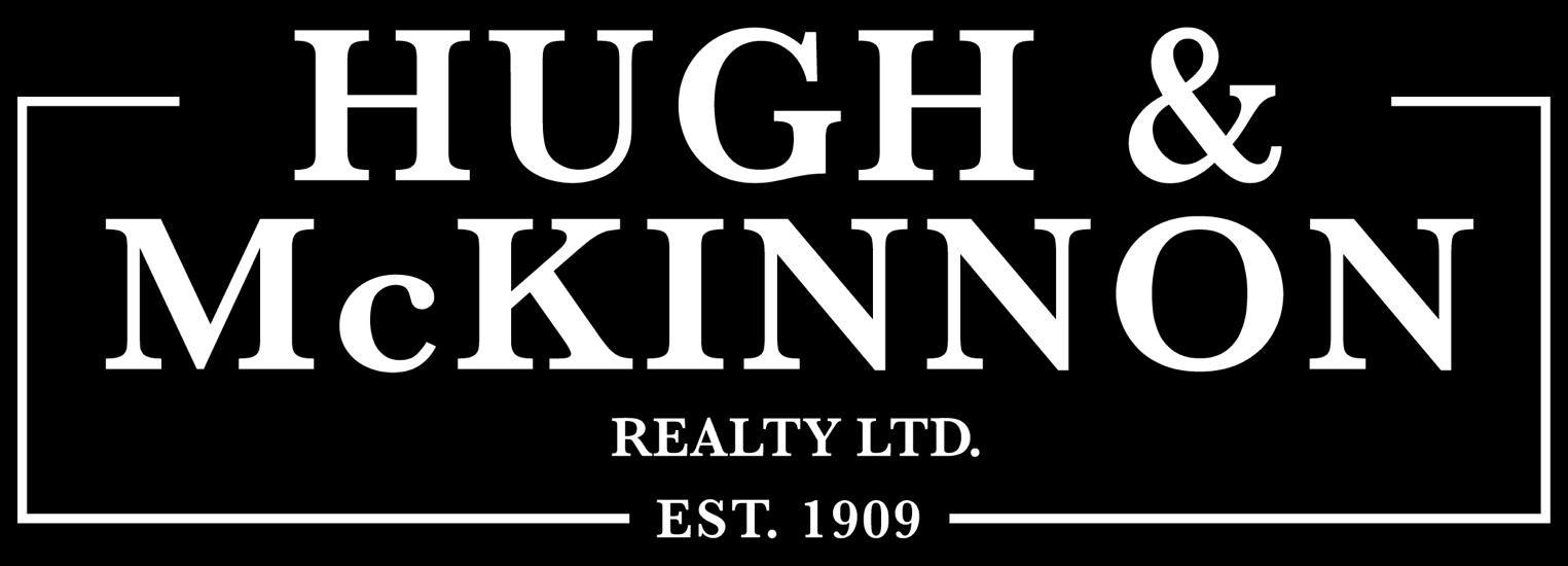 A black and white image of a sign for Hugh & McKinnon Realty LTD, established in 1909.