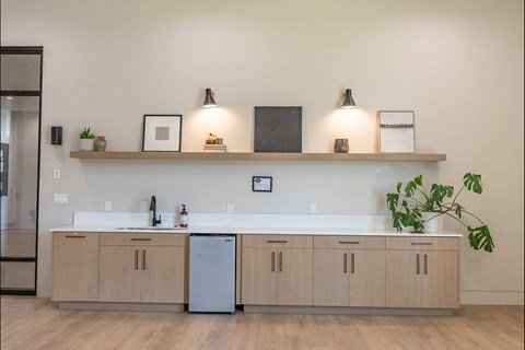 A kitchen with a white countertop and wooden cabinets at Northplace Apartment Homes, Oregon
