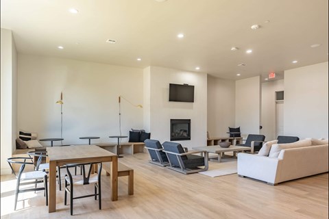 A modern living room with a fireplace and a television at Northplace Apartment Homes, Salem, 97305