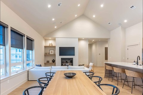 A modern dining room with a wooden table and chairs at Westgate Apartment Homes, Pendleton, OR