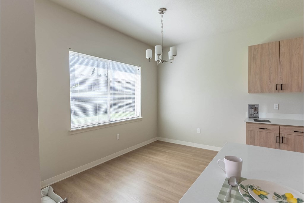 A dining room with a table set for two at Cascade Place Apartment Homes, Molalla, Oregon