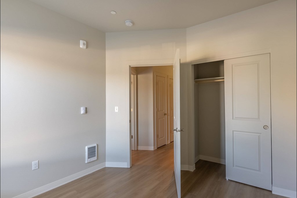 A room with a doorway leading to another room at Cascade Place Apartment Homes, Molalla, 97038