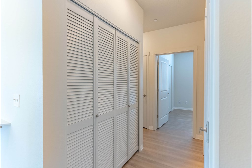 Closet with white doors in a room at Cascade Place Apartment Homes, Molalla, OR, 97038