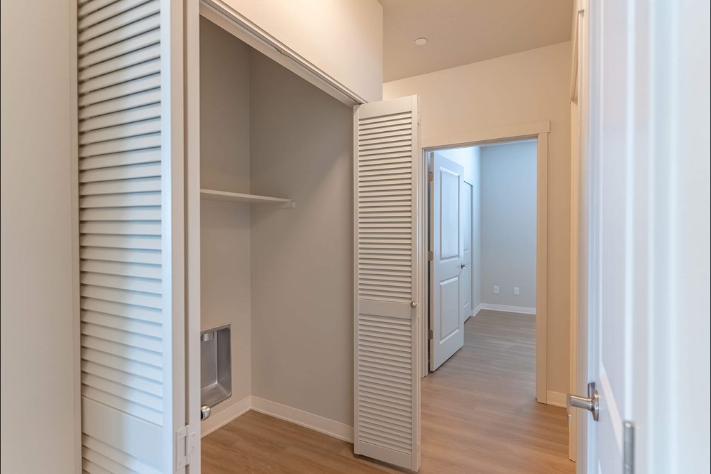 A white interior with a doorway leading to another room at Cascade Place Apartment Homes, Molalla, 97038