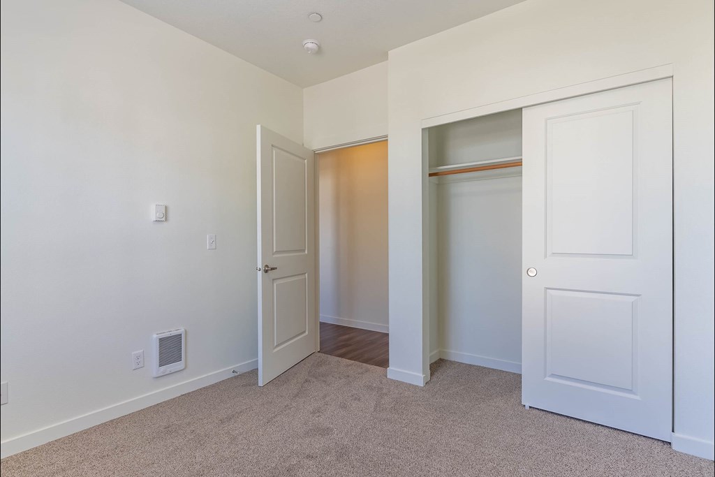A room with a white door and a window at Riverplace Apartment Homes, Independence, 97351