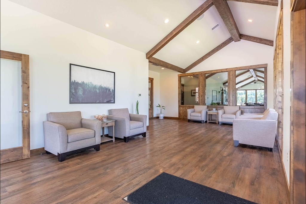 A living room with wooden floors and furniture at Riverplace Apartment Homes, Independence, 97351