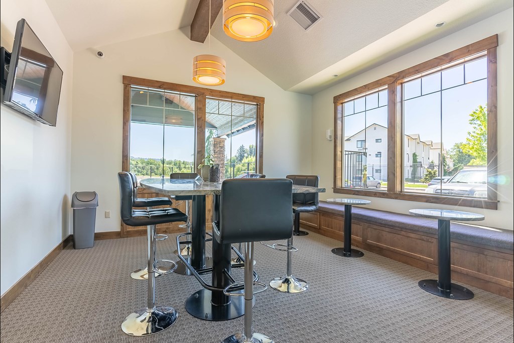 A room with a table and chairs and a window at Riverplace Apartment Homes, Independence, OR