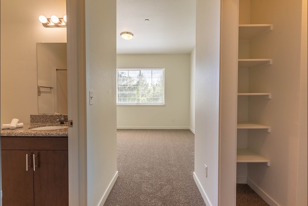 A room with a carpeted floor and a window at Riverplace Apartment Homes, Oregon, 97351