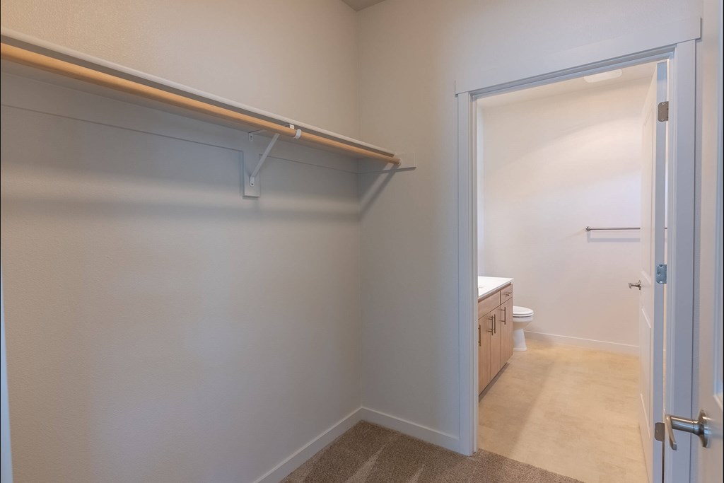 A white door is open to a bathroom at Sandyplace Apartment Homes, Oregon, 97055
