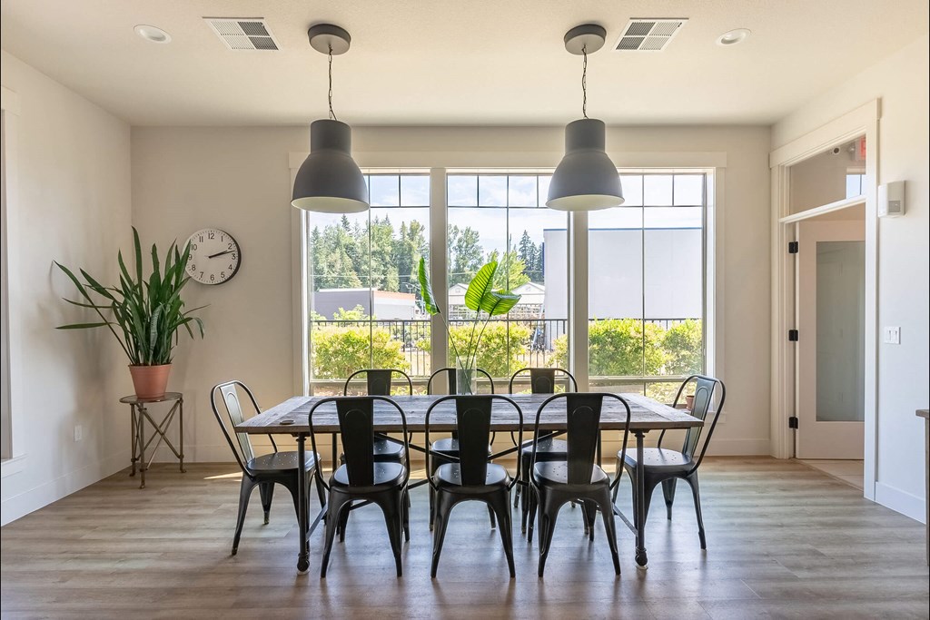 A dining room with a table set for six. A dining room with a table set for six at Silverplace Apartment Homes, Silverton
