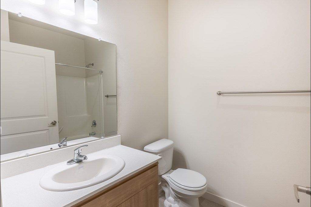 A white sink is on a countertop in a bathroom at Silverplace Apartment Homes, Silverton, Oregon