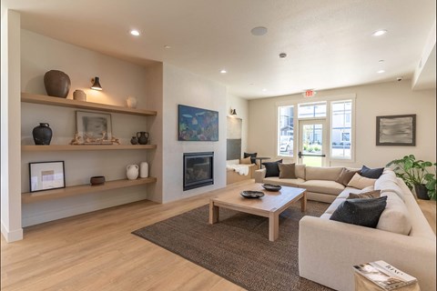 A living room with a fireplace and a couch.