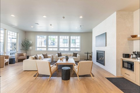 A modern living room with a fireplace and a television.