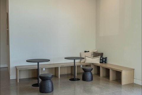 A room with a table and a bench.