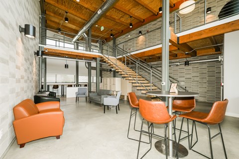 A modern open plan office space with a staircase.