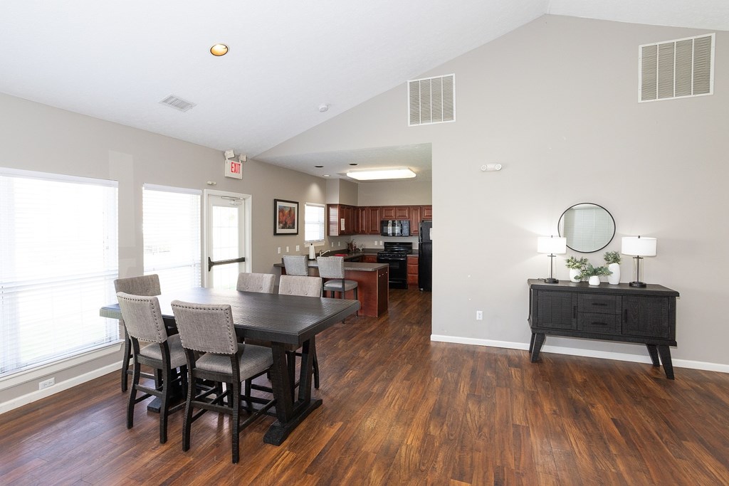 A dining room with a table and chairs is shown.