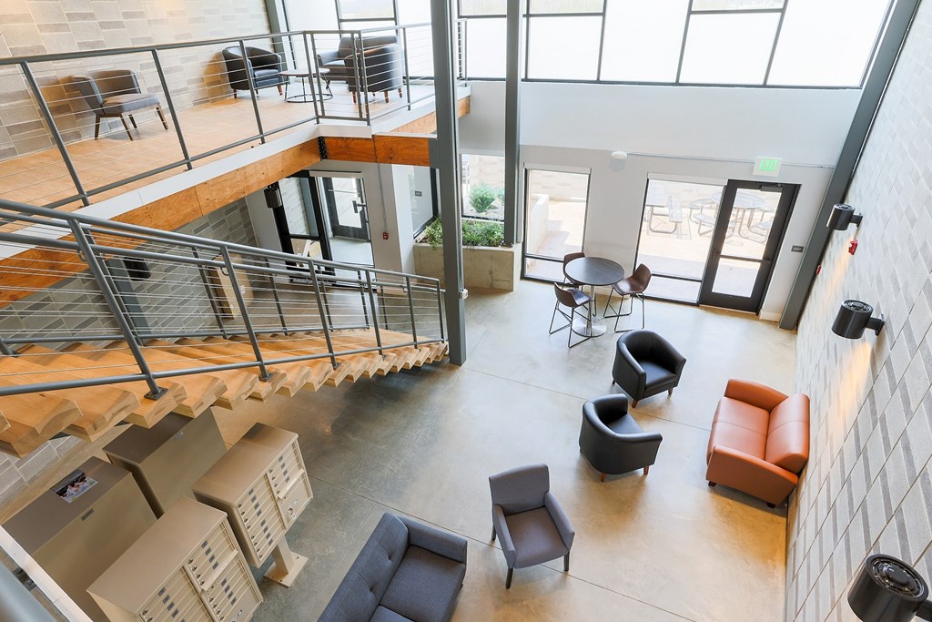 A modern interior with a spiral staircase and seating area.