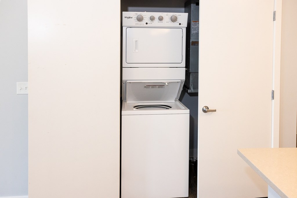 A white dishwasher and oven in a kitchen.