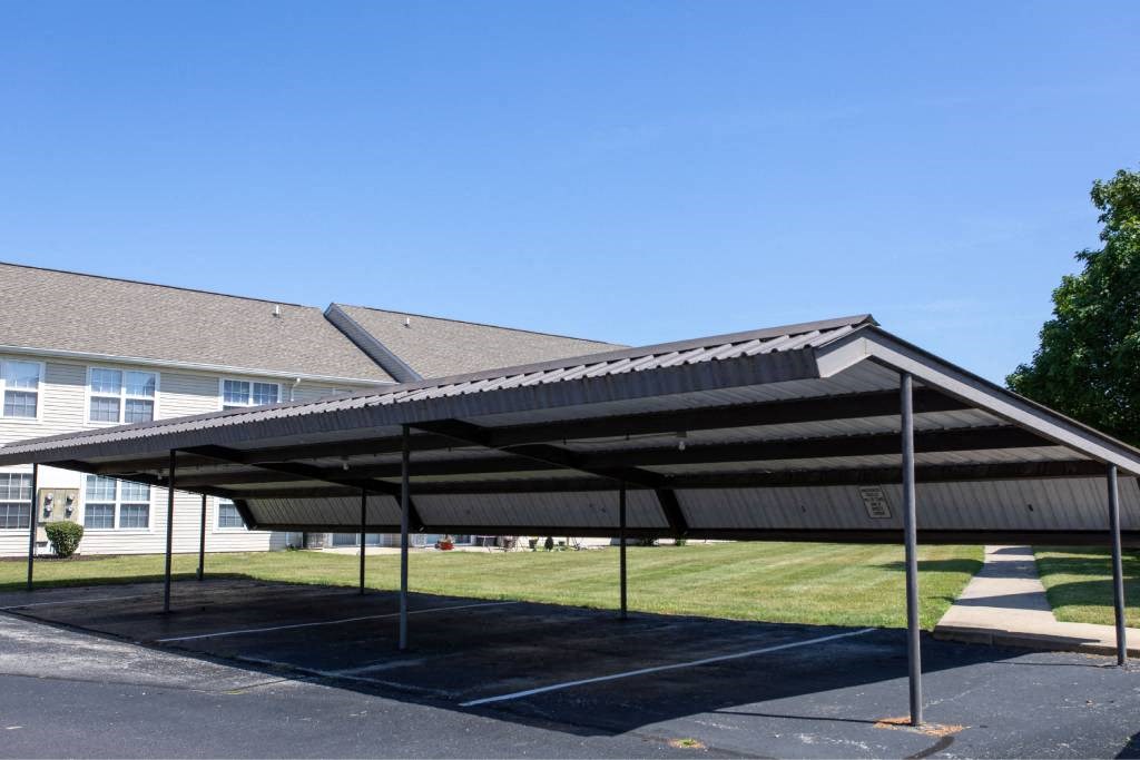 A large black canopy over a parking lot.