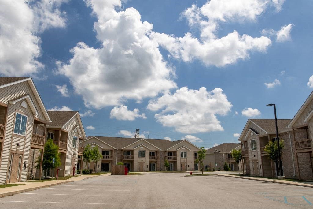 A row of houses with a clear blue sky above them.