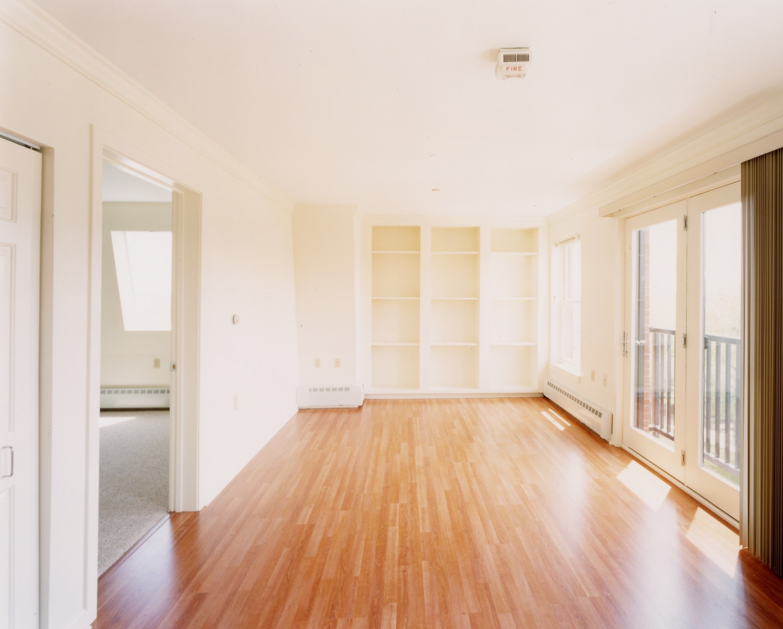 A room with wooden floors and white walls.